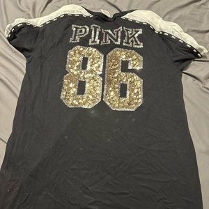 pink size medium fancy tee shirt slightly worn